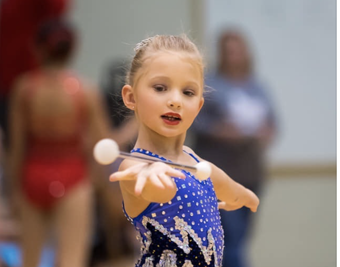 Young baton twirler executing a handspin